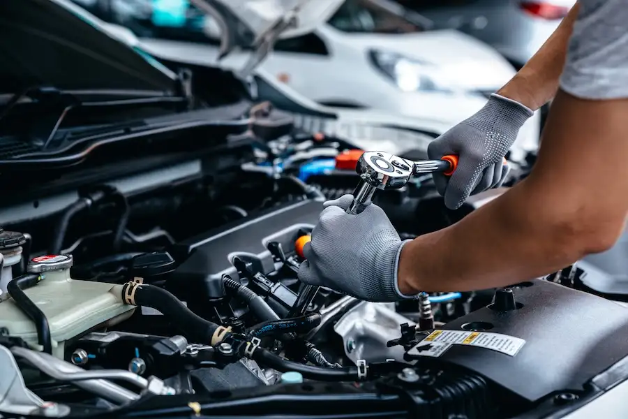 car mechanic fixing car